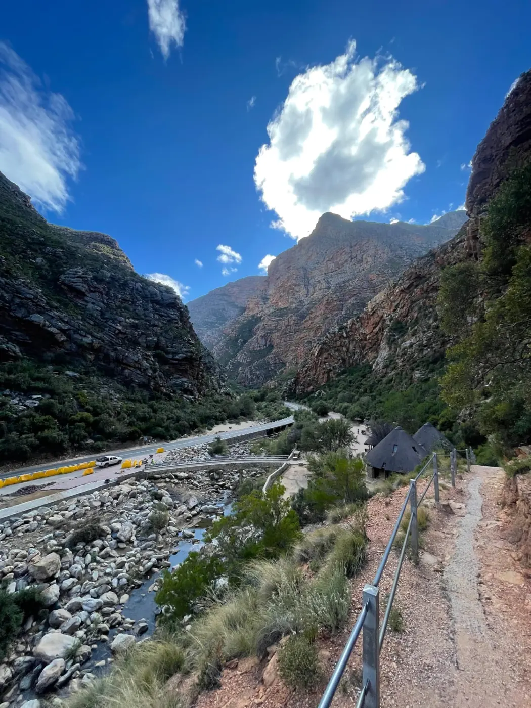 The Route 62 road winding through the Klein Karoo mountains near De Rust, Western Cape