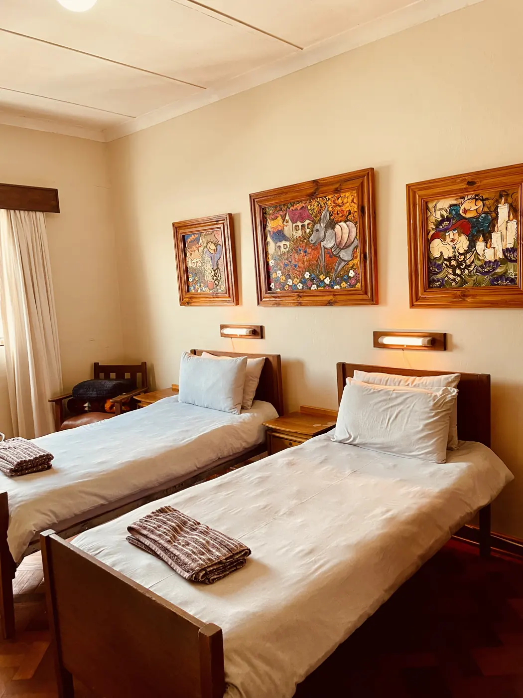 Cosy twin room with warm bedside lamps at Hotel De Rust, De Rust, Klein Karoo